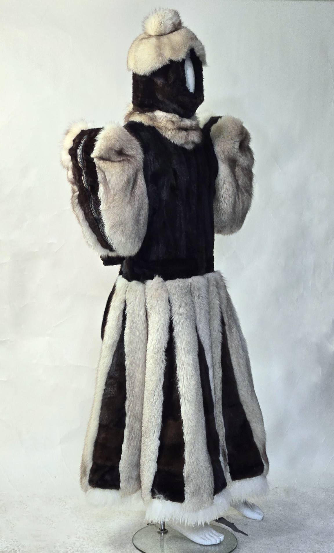 Black and white fur bitch suit with restrictive sleeves and pleated skirt — front view on mannequin — D&Y Furs